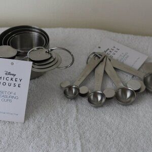 MICKEY MOUSE HEAD SHAPED MEASUREING CUPS AND MEASURING SPOONS DONE IN METAL.